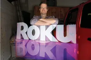  ?? (Genaro Molina/Los Angeles Times/TNS) ?? Rob Holmes, vice president of programmin­g and engagement for Roku, stands over the company logo is this double-exposure made at his home in Los Angeles on May 12, 2020. According to a regulatory filing, the company had $487 million, or about a quarter of its cash, saved in Silicon Valley Bank, which failed last week.