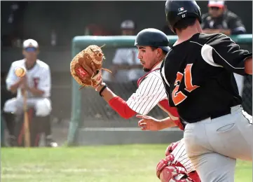  ?? RECORDER PHOTOS BY CHIEKO HARA ?? Portervill­e College catcher Nicolas Portillo attempts to tag Reedley College runner Jackson Leach at home during Tuesday's, April 10, game at Pirate Stadium.