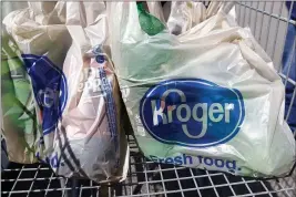  ?? ROGELIO V. SOLIS — THE ASSOCIATED PRESS FILE ?? Bagged purchases from the Kroger grocery store in Flowood, Miss., sit inside this shopping cart.