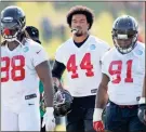  ?? / AP-David Goldman, File ?? Vic Beasley (44) walks with teammates on the field during training camp.