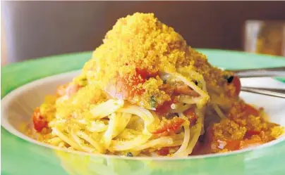  ?? CLAIRE PEREZ/COURTESY ?? A golden crown of bottarga, salt-cured grey mullet roe, sits atop a tangled pedestal of spaghetti at Sardinia Enoteca Ristorante.