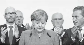  ??  ?? “We had hoped for a better result,” Merkel told a clapping but subdued crowd at party headquarte­rs in Berlin