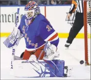  ?? Frank Franklin II / Associated Press ?? A shot by Joe Pavelski of the Stars gets past Rangers goaltender Henrik Lundqvist during the first period of Monday night’s game in New York.