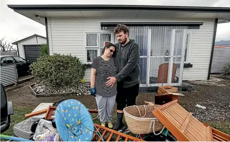  ?? CHRIS SKELTON/STUFF ?? Amy Axford-Hooker and her partner Tyler Croft have lost everything in the recent flooding and will need to find somewhere else to live. Amy is due to give birth in two weeks.