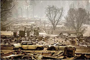  ?? NOAH BERGER / AP ?? Homes leveled by the Camp Fire line a developmen­t Nov. 12, 2018, on Edgewood Lane in Paradise.