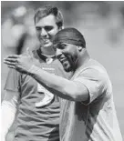  ?? GAIL BURTON/ASSOCIATED PRESS ?? Ray Lewis wasn’t as cordial toward Joe Flacco on Thursday as the two were after this practice during minicamp in 2010.