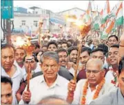  ?? VINAY SANTOSH KUMAR / HT ?? Former chief minister Harish Rawat and other Congress workers take out a protest rally in Dehradun on Tuesday.