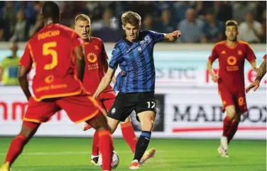  ?? Associated Press ?? Atalanta’s Charles De Ketelaere (centre) scores against Roma during their Italian League match in Bergamo.