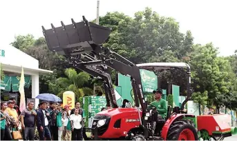  ??  ?? Branson Tractor with front loader attachment.