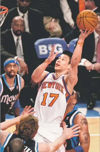  ?? By Debby Wong, US Presswire ?? Coming through: Knicks point guard Jeremy Lin goes up for a layup Sunday during the first half against the Mavericks at Madison Square Garden. Lin had 28 points and a career- high14 assists in New York’s104- 97 victory.