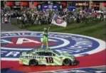  ?? RACHEL LUNA — THE ASSOCIATED PRESS ?? Kyle Buschs stands on his car after winning the NASCAR Cup Series auto race at Auto Club Speedway in Fontana Sunday. The win was the 200th for Busch across NASCAR’s three national series.