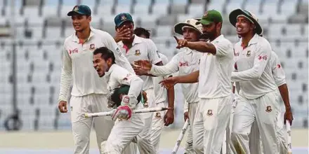  ?? AFP PIC ?? Bangladesh captain Mushfiqur Rahim (second from left) celebrates with teammates after winning the first Test against Australia on Wednesday.