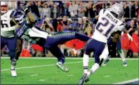  ?? AP/MICHAEL CONROY ?? New England defensive back Malcolm Butler (21) sealed the Patriots’ fourth Super Bowl victory in the past 14 years with his fourth-quarter intercepti­on Sunday.