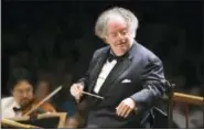  ?? MICHAEL DWYER — THE ASSOCIATED PRESS FILE ?? In this file photo, Boston Symphony Orchestra music director James Levine conducts the symphony on its opening night performanc­e at Tanglewood in Lenox., Mass. New York’s Metropolit­an Opera says it will investigat­e allegation­s that its longtime...