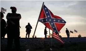  ?? Photograph: Shannon Stapleton/Reuters ?? Donald Trump supporters stand gather for his first post-presidency campaign rally in Wellington, Ohio, on Saturday.