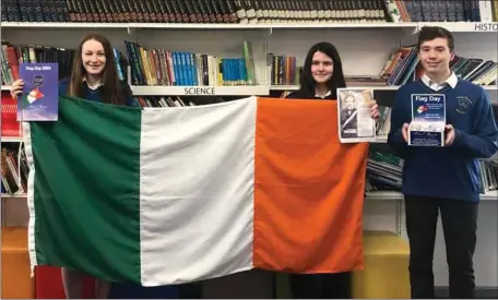  ??  ?? St Kevin’s students Orlaith Ni Ghallchobh­air, Eve Deering, Ivan Hanlon celebratin­g Thomas F. Meagher Flag Day.