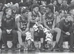  ?? LON HORWEDEL/USA TODAY SPORTS ?? Cade Cunningham, center, talks with Jaden Ivey, left, and center James Wiseman on the bench during the Pistons’ loss to the Celtics on Friday night.