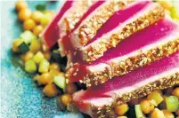  ?? RICARDO ?? Spice-crusted tuna steaks are a perfect peppery entrée to serve up with a cool salad of chickpeas, apples and zucchini.