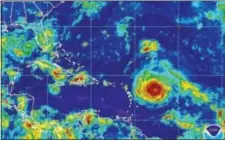  ?? NOAA VIA AP ?? This Monday satellite image provided by the National Oceanic and Atmospheri­c Administra­tion shows Hurricane Irma nearing the eastern Caribbean. Hurricane Irma grew into a powerful Category 5 storm Tuesday.