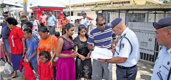  ?? Photo: Ronald Kumar ?? Police Commission­er Brigadier-General Sitiveni Qiliho talks with people in Nausori Town during the Commission­er’s Beat on December 28, 2017.