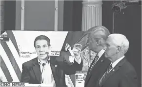  ?? TASOS KATOPODIS/ GETTY IMAGES ?? President Donald Trump and Vice President Mike Pence watch a television news clip of New York Gov. Andrew Cuomo last April.