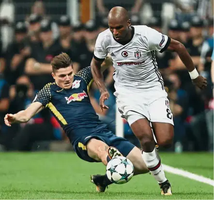  ??  ?? Nightmare in Turkey: RB Leipzig’s Timo Werner (left) trying to tackle Besiktas’ Ryan Babel during their Champions League Group G match on Tuesday. Babel scored one of the goals in the 2- 0 win. — Reuters