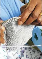  ?? Picture: SUPPLIED ?? BUSY HANDS: One of the women taking part in Rotary Ann’s project at the Oncology Step Down (J2) ward at Frere Hospital, knitting herself a scarf