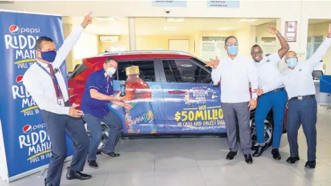  ?? CONTRIBUTE­D ?? Joining forces: Team Hyundai and Pepsi were excited for the unveiling of the grand prize vehicle – a 2020 Hyundai Venue. From left are: Etus Collman, Michael Lopez Castillo, Jose Melo, Etmour Williams and Erick Gutierrez.