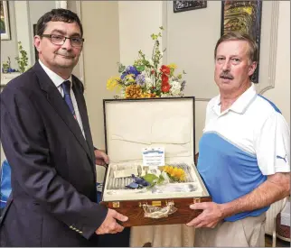  ??  ?? Charlevill­e Golf Club President Barra O’Dwyer presenting D.J. Hourigan with his Presidents’ prize, which he won recently.