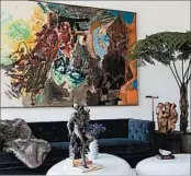  ?? LAUREN SILBERMAN/DRAKE ANDERSON ?? In this New York living room designed by Drake Anderson, large-scale art plays a starring role in the decor scheme.
