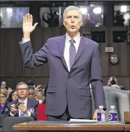  ?? PABLO MARTINEZ MONSIVAIS / AP ?? Supreme Court justice nominee Neil Gorsuch is sworn in during his confirmati­on hearing before the Senate Judiciary Committee on Capitol Hill on Monday. Committee members will begin questionin­g Gorsuch today.