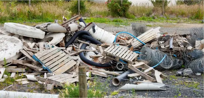  ??  ?? Messy situation:
A reader is worried that the value of land he intends selling could be affected by his neighbour’s growing pile of rubbish