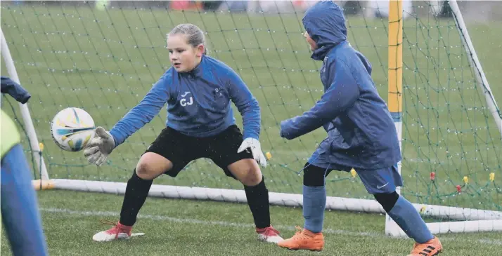  ??  ?? Boldon CA Girls (green bibs) v Hartlepool Pools Youth Girls White (blue).