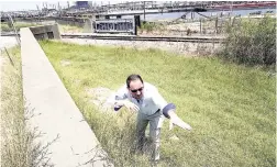  ?? AP ?? Resident engineer Steve Sherrill, with the US Army Corps of Engineers, shows how much height will be added to some of the levees and seawalls near a refinery in Port Arthur, Texas.