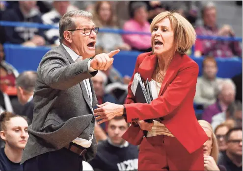  ?? Jessica Hill / Associated Press ?? UConn coach Geno Auriemma, left, is held back by associate coach Chris Dailey as he argues a call during a game against Baylor last season in Hartford.