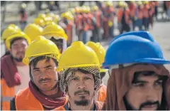  ?? AFP ?? Men queue to register for a ‘food-for-work’ programme launched by Afghanista­n’s Taliban government to tackle hunger in the nation.