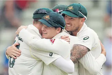  ?? REUTERS ?? Australia’s Steve Smith, centre, celebrates with teammates after their win against England in the first Ashes Test.