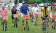  ?? DIGITAL FIRST MEDIA FILE PHOTO ?? Cindy Adams Dunn, center in the blue top, secretary of the Pennsylvan­ia Department of Conservati­on and Natural Resources, riding a Bike Pottstown bicycle arrives at Memorial Park on June 25, 2015, to make an announceme­nt about an outdoor recreation...