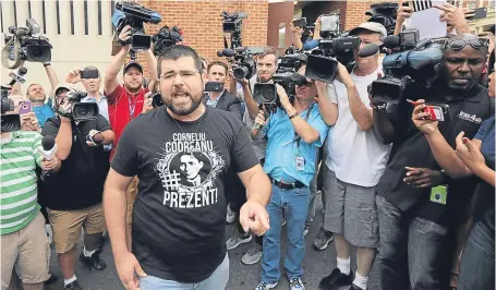  ?? Picture: Getty Images. ?? Matthew Heinbach of the white nationalis­t Traditiona­list Workers’ Party shouting at journalist­s gathered outside the General District Court building in Charlottes­ville, Virginia.