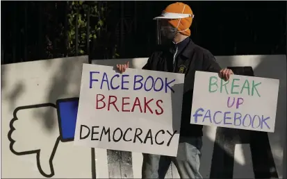  ?? JEFF CHIU — THE ASSOCIATED PRESS ?? A demonstrat­or joins others outside of the home of Facebook CEO Mark Zuckerberg to protest what they say is Facebook spreading disinforma­tion in San Francisco on Nov. 21.
