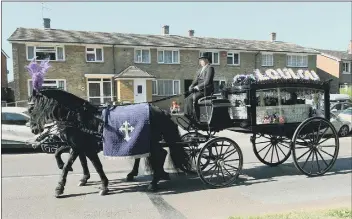  ?? Picture: Sarah Standing ?? FINAL JOURNEY The horse and carriage containing Louise Smith’s coffin