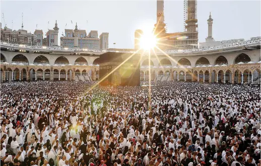  ?? AFP file photo/Supplied ?? Pilgrims from around the world circumambu­late the Holy Kaaba before sunset on the first day of fasting in Ramadan at the Grand Mosque in Makkah, last year.