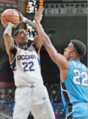  ?? JESSICA HILL/AP PHOTO ?? UConn’s Terry Larrier looks to shoot as Columbia’s Nate Hickman, right, defends, during the first half of Wednesday night’s game at Gampel Pavilion in Storrs. Larrier scored eight points, but added a career-high 14 rebounds as the Huskies overcame a...