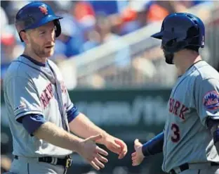  ?? GETTY ?? Pete Alonso rounds bases with smile on face after his 40th homer of season sets new single-season mark for NL rookies, while Todd Frazier (inset l.) gets congratula­ted by Tomas Nido after scoring during seventh-inning rally that has Mets coming back to NYC on a high note and primed for crucial homestand.