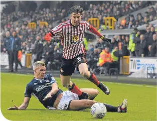  ??  ?? Millwall striker Steve Morison gets a tackle in on Sunderland’s Bryan Oviedo