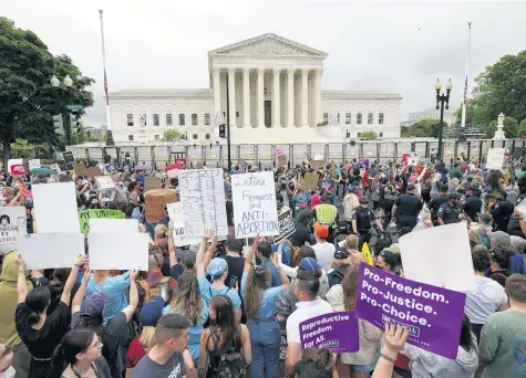  ?? KEVIN DIETSCH / GETTY IMAGES ?? Abortion rights activists participat­e in a “Bans Off Our Bodies” rally outside the U.S. Supreme Court in Washington on Saturday.