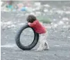  ?? — Reuters ?? A boy leans on a tyre at a camp for internally displaced people (IDPS) near Sanaa, Yemen.