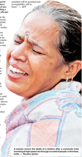  ?? — Reuters photo ?? A woman mourn the death of a relative after a commuter train traveling at high speed ran through a crowd of people in Amritsar, India.