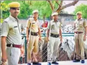  ?? HT PHOTO ?? Policemen stand with the cows before sending them off to Tamil Nadu on Wednesday.