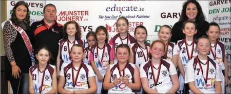  ??  ?? Muire Gan Smál junior team with ‘Miss Basketball’ Shauna Aherne, coach Tommy Dom O’Connor and teacher Emma Sweeney. Front from left: Maja Moskal, Molly Moran, Basia Dolata, Grace McGovern and Amelia Jarza. Back from left: Muireann Hickey, Nell Hartnett, Aisha Pabon, Eimear Bradley, Emily Moran, Molly O’Regan, Kate Harmon and Lily Brosnan.